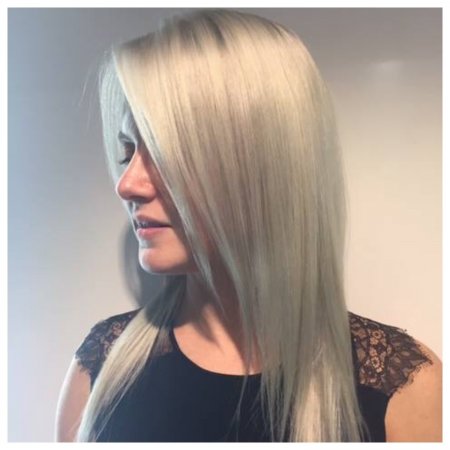 Prelightened hair with a snow white icy toner created by Thea at the klinik