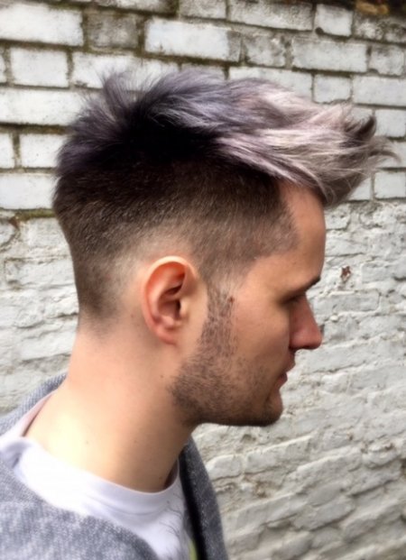 Short gents haircut being coloured in a black / grey / siver fade to achieve an amazing blend and depth to his hair. using Olaplex throughout the service. Done by Thea at the klinik hairsalon London.