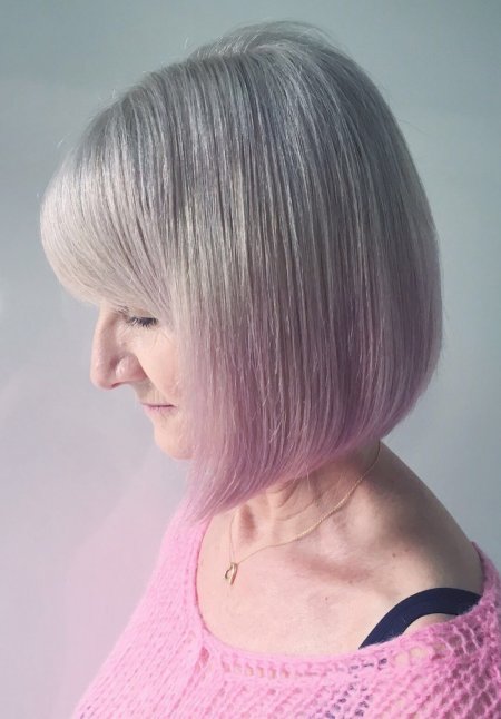 Natural white hair has been dip dyed with a soft pink on the tips of the hair by Leyla at the klinik