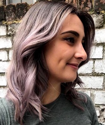 Silver grey hair has been toned with a bit of lilac by Kenra metallics and Pravana to add a bit of change to the tone by Thea at the klinik hairdressing London 