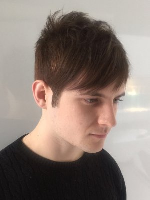 A gents haircut as a textured crop with a square crown and leaving the fringe longer at the front done by Mark at the klinik hairdrressing London 