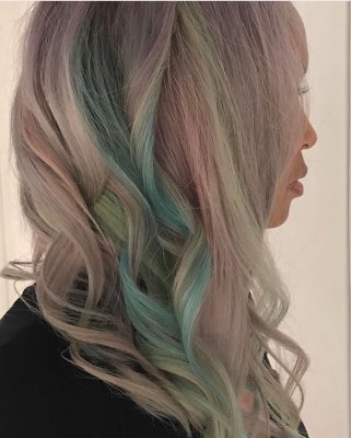 Hair being pre lightened and then coloured using Pravana colours to create a pastel mix of tones by Thea at the klinik salon London