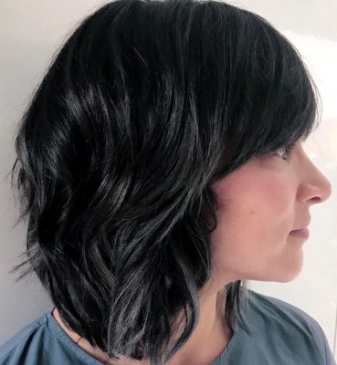 Shoulder long hair being coloured using kenra metallics to create a blue black metallic finish by Thea at the klinik hairdressing London 