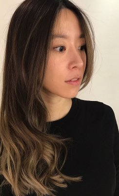 Dark asian hair being coloured with a baby highlight /balayage technique to create a soft ashy blonde by Thea at the klinik hairdressing
