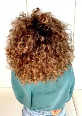 Big curly hair coloured natural sunkissed at the klinik salon London