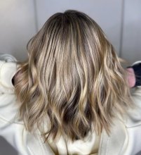Multi coloured blonde highlights on a woman's hair at the klinik salon 